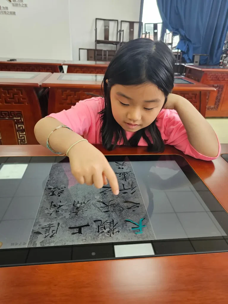 QISS_Chinese_Calligraphy_Student_Tablet_04-768x1024 Students Explore the Art of Chinese Calligraphy