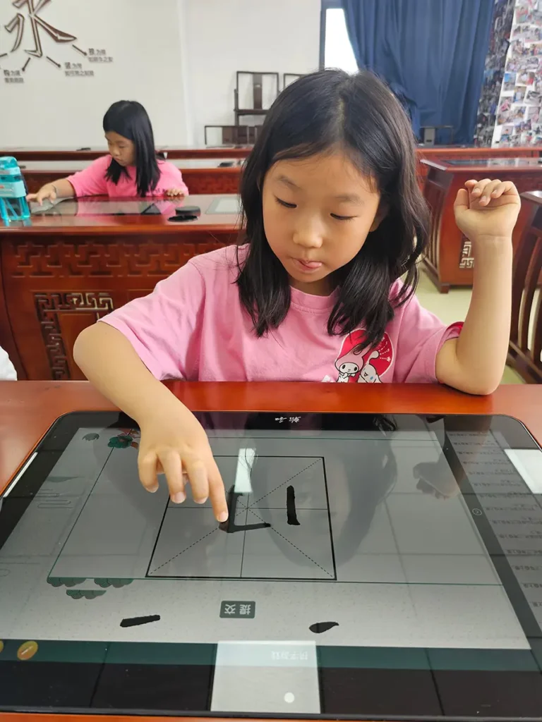 QISS_Chinese_Calligraphy_Student_Tablet_08-768x1024 Students Explore the Art of Chinese Calligraphy