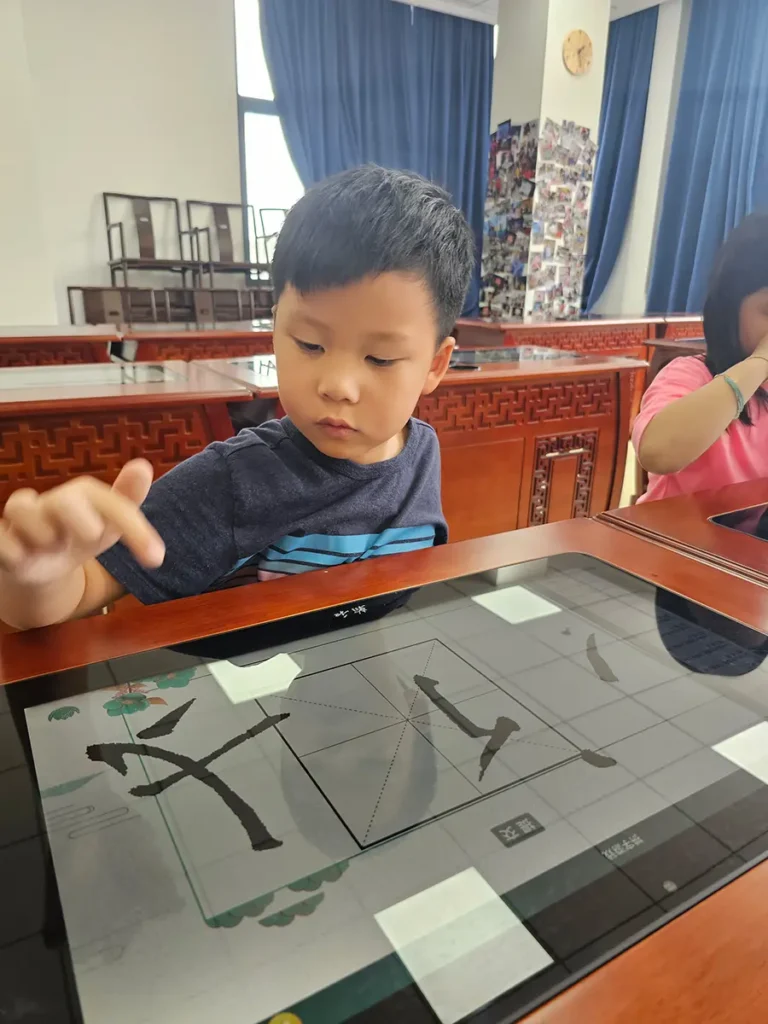 QISS_Chinese_Calligraphy_Student_Tablet_10-768x1024 Students Explore the Art of Chinese Calligraphy